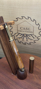 Brass raw roller ball in flame box elder