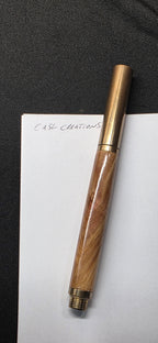 Brass raw roller ball in flame box elder