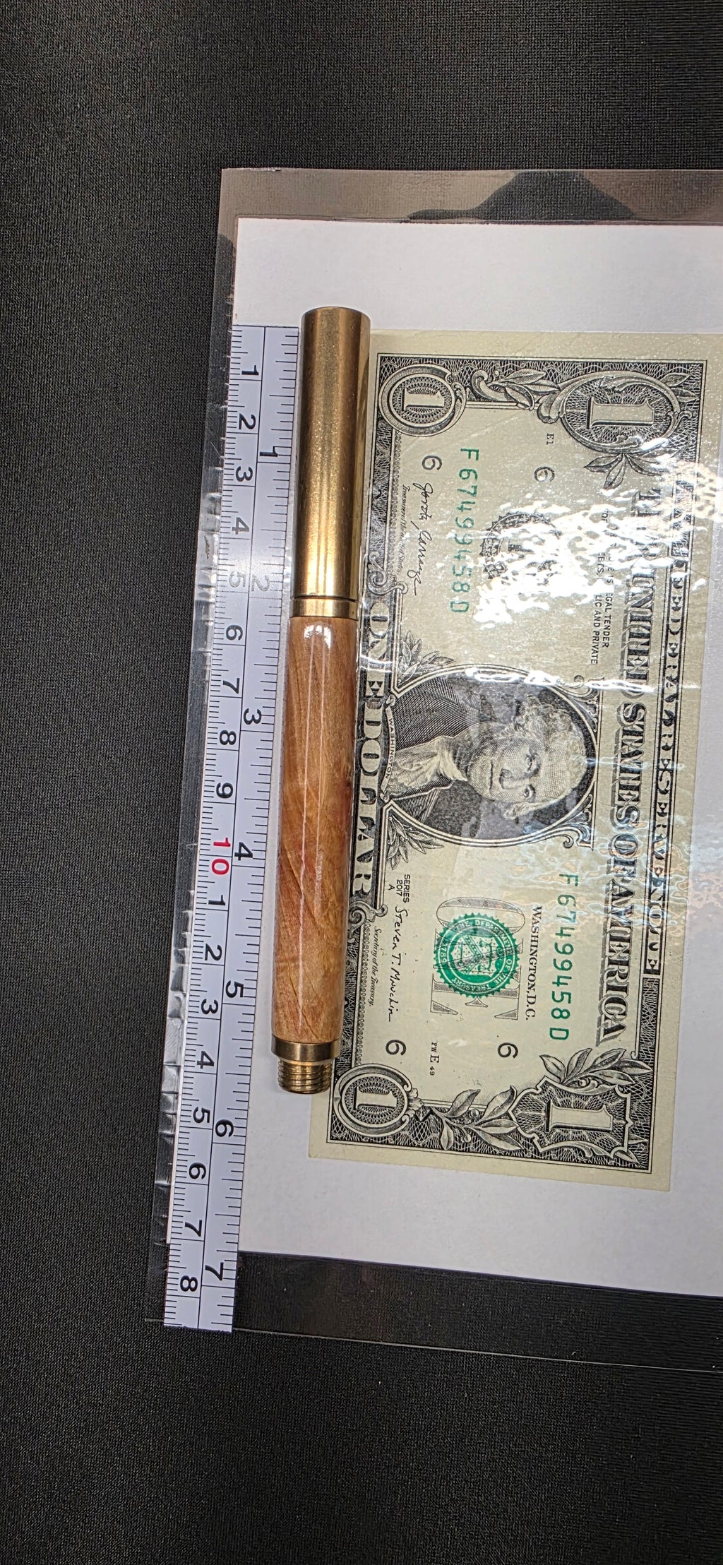 Brass raw roller ball in flame box elder