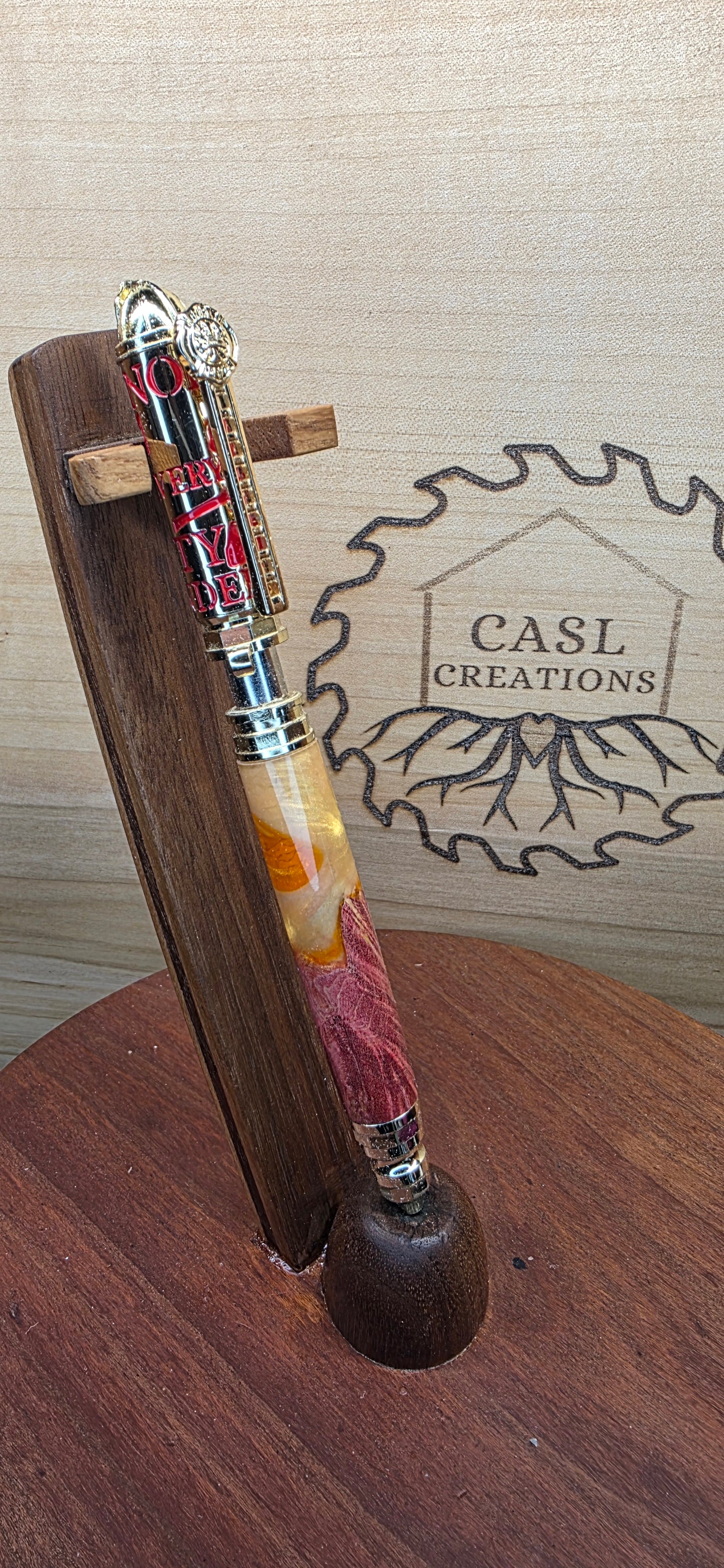 Polished Brass and Red Firefighter "Push and Lock" in red dyed maple and orange and yellow shimmering alumilite resin