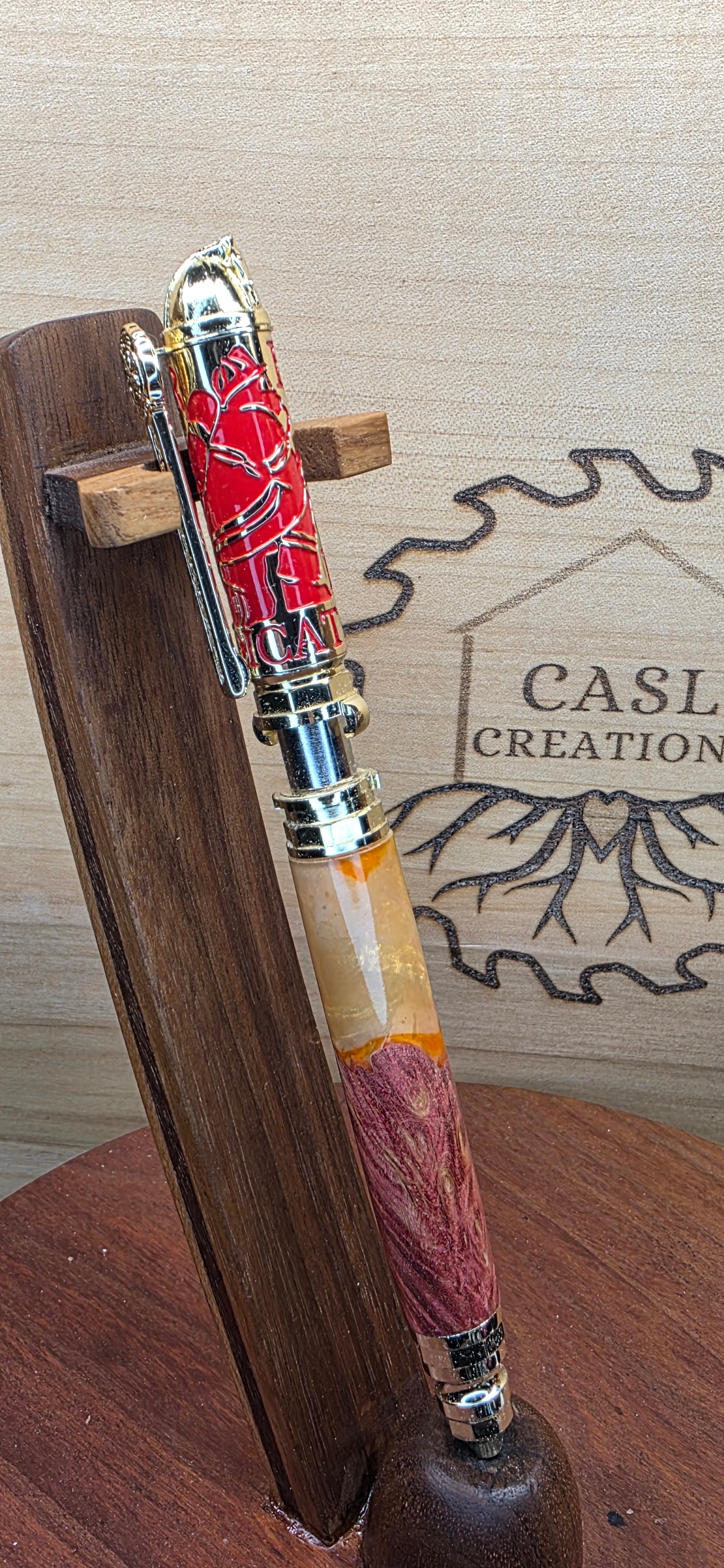 Polished Brass and Red Firefighter "Push and Lock" in red dyed maple and orange and yellow shimmering alumilite resin
