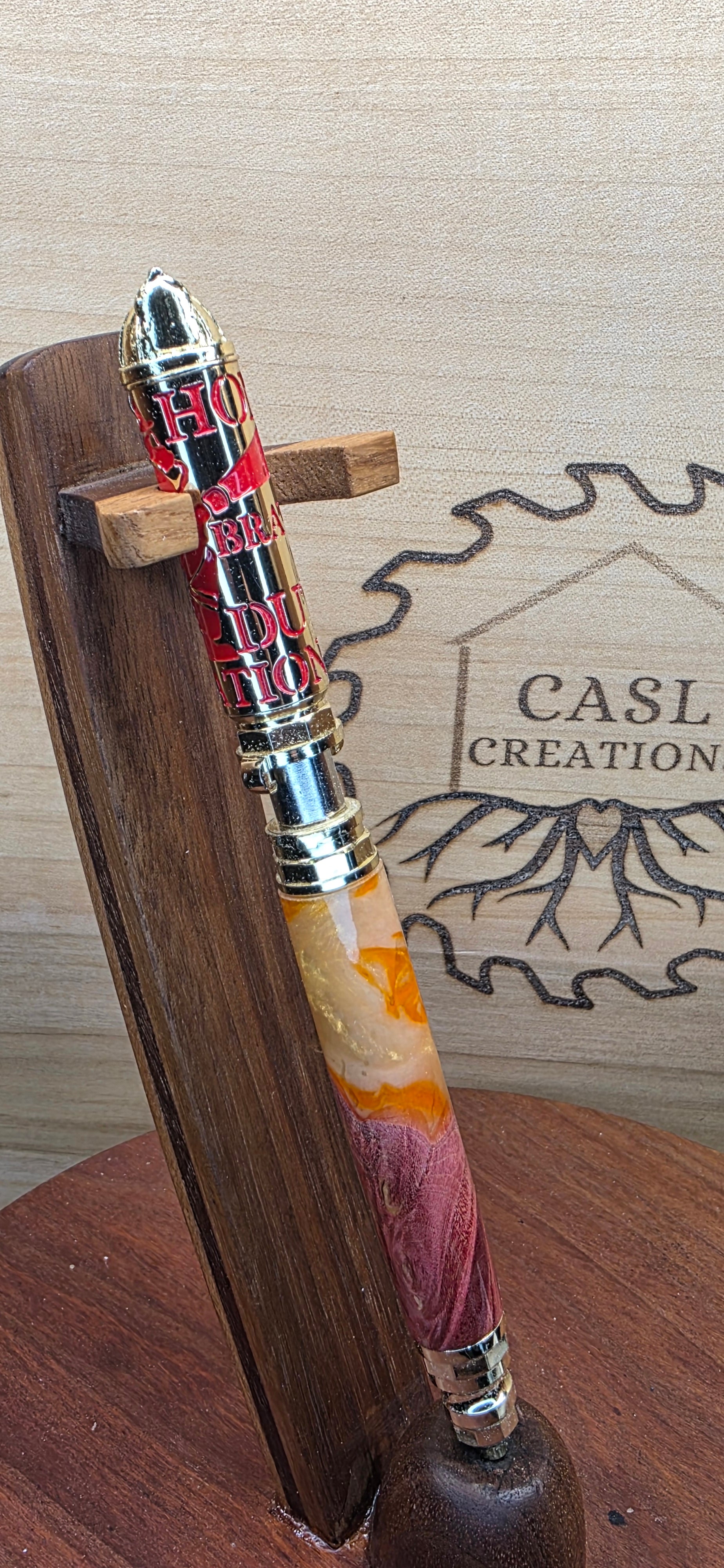 Polished Brass and Red Firefighter "Push and Lock" in red dyed maple and orange and yellow shimmering alumilite resin